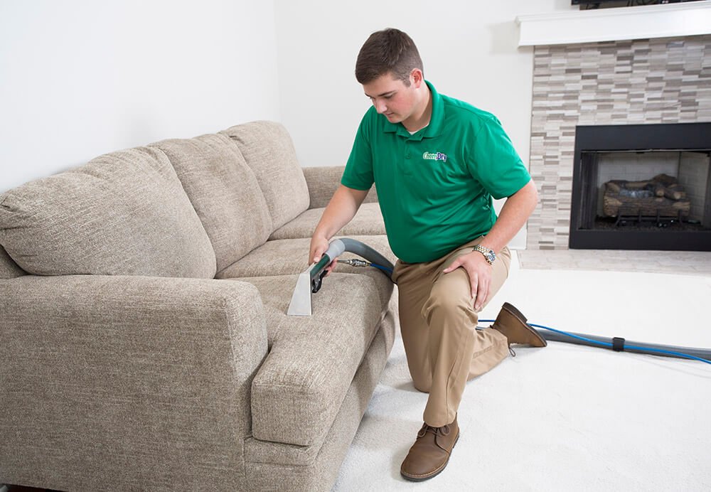 CJ's Chem-Dry tech performing upholstery cleaning in Anoka County, MN home