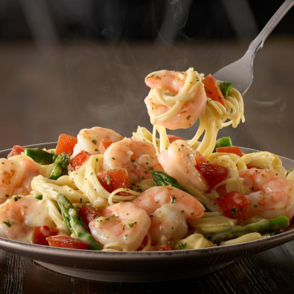 Shrimp Scampi: Lighter take on an Italian classic! Shrimp sauteÌed in a garlic sauce, tossed with asparagus, tomatoes and angel hair.