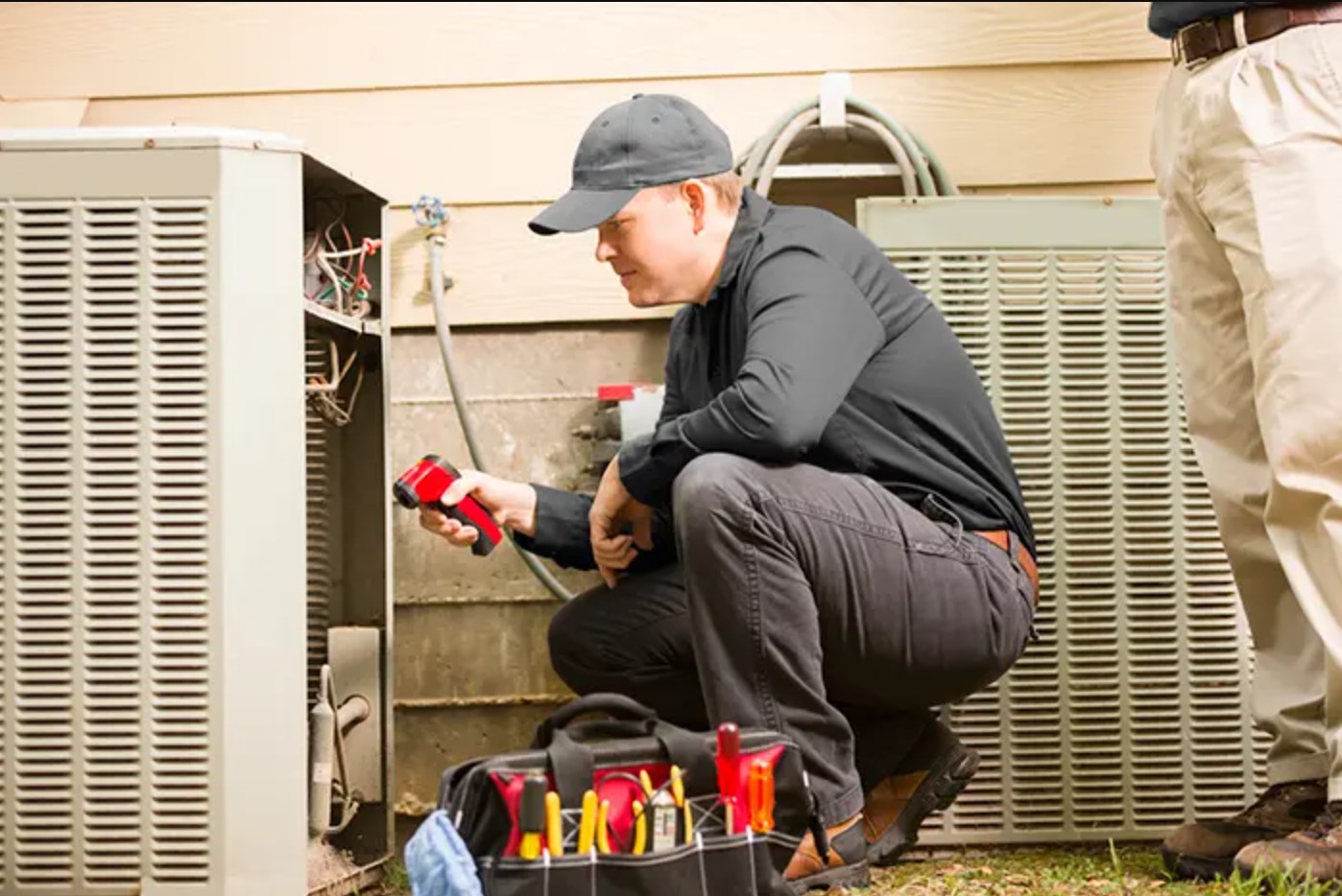 Harp HVAC technician performing HVAC repairs