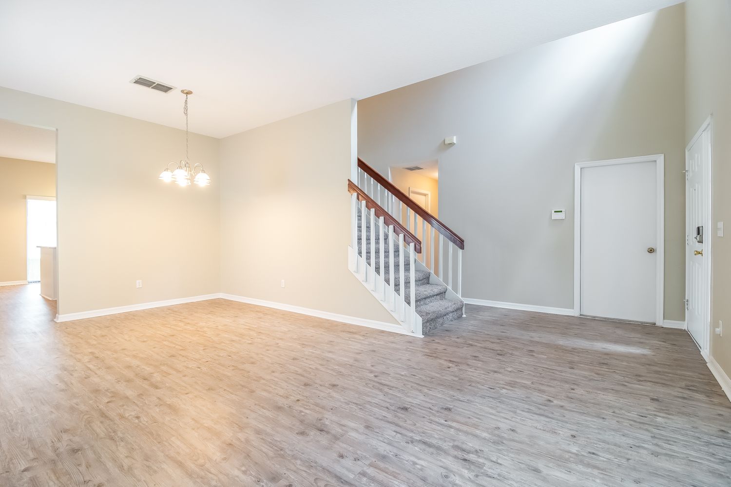 This beautiful home in Orlando, Florida features luxury vinyl plank flooring throughout the living area.