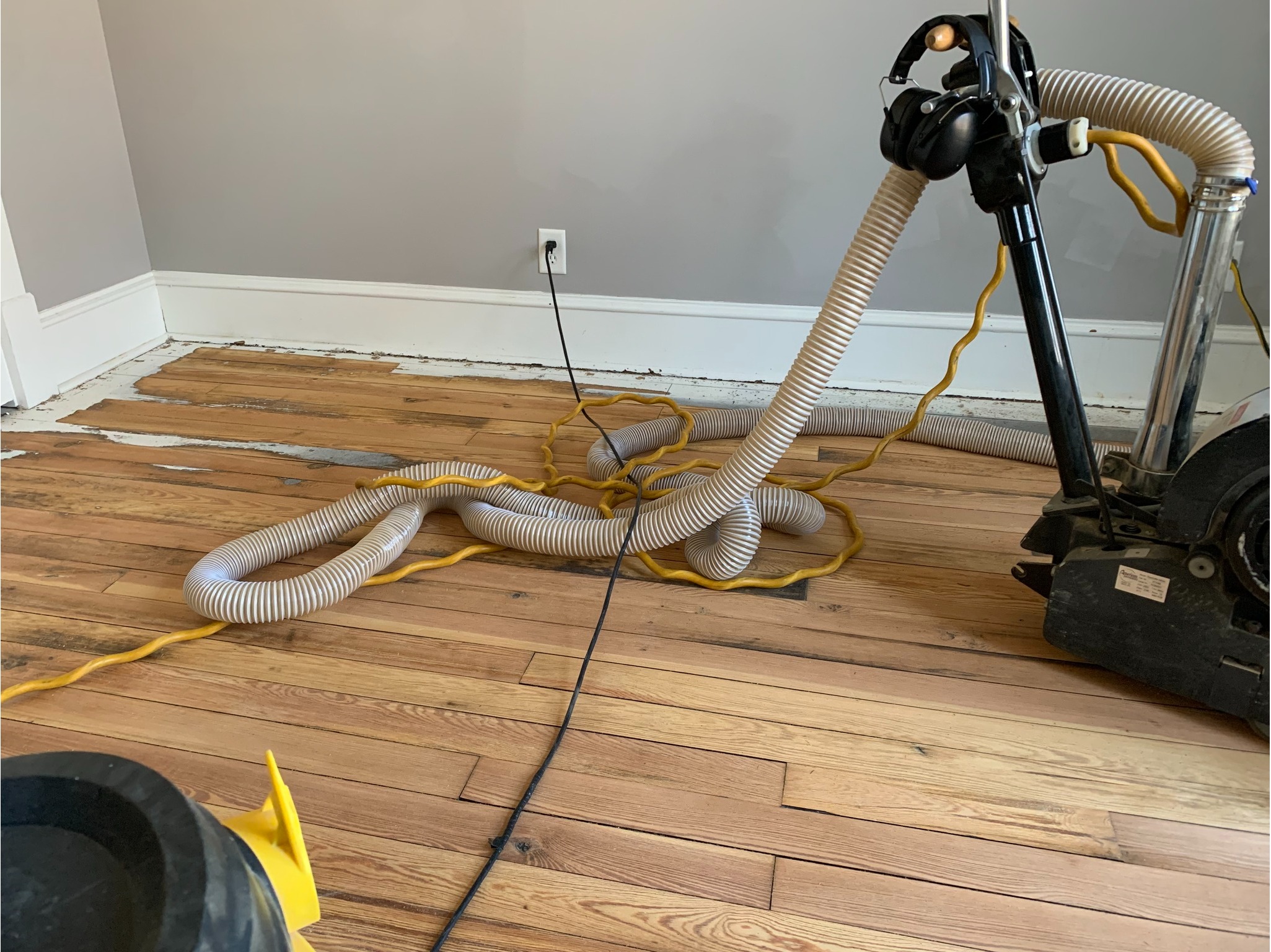 Freshly sanded and refinished natural hardwood bedroom floor after professional restoration - Winona FloorCraft hardwood floor refinishing results in Winona Lake, Indiana.