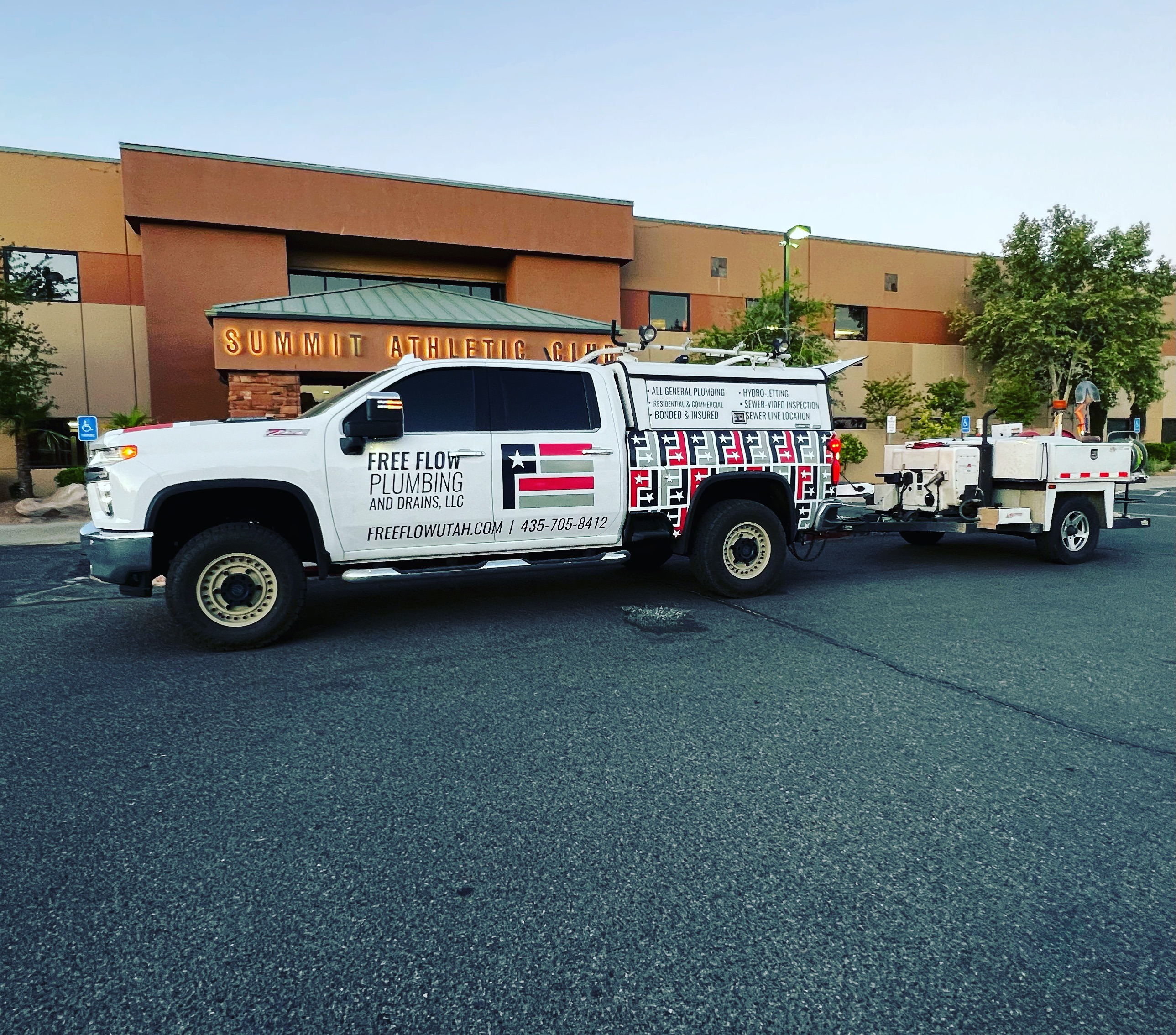 A Free Flow Plumbing and Drains service truck is parked outside Sanchez Mexican Food in Washington, Utah. The branded white work truck features the company’s bold American-inspired logo and full-service plumbing decals, reflecting professionalism and community presence. This photo showcases the team’s readiness and mobility to serve local businesses and residents throughout the area.