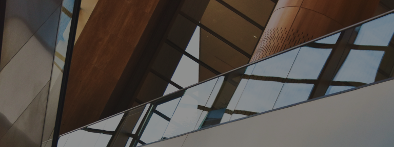 Close up, abstract view of a modern building with wooden accents.