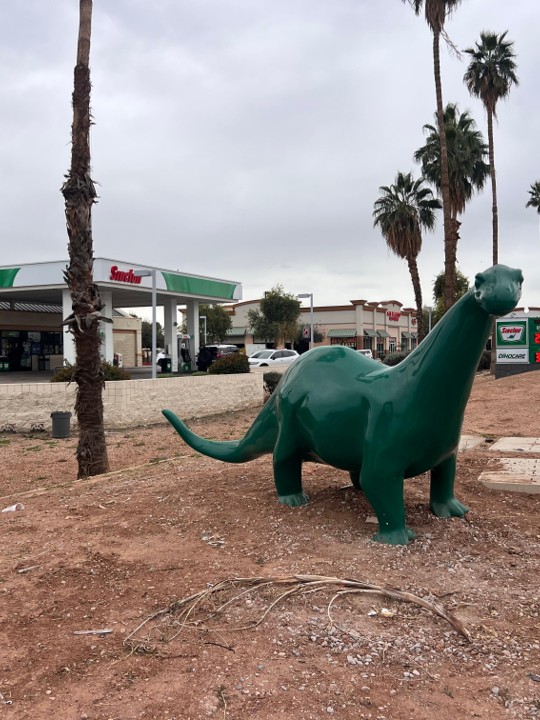 Sinclair gas station fueling island and DINO statue.
