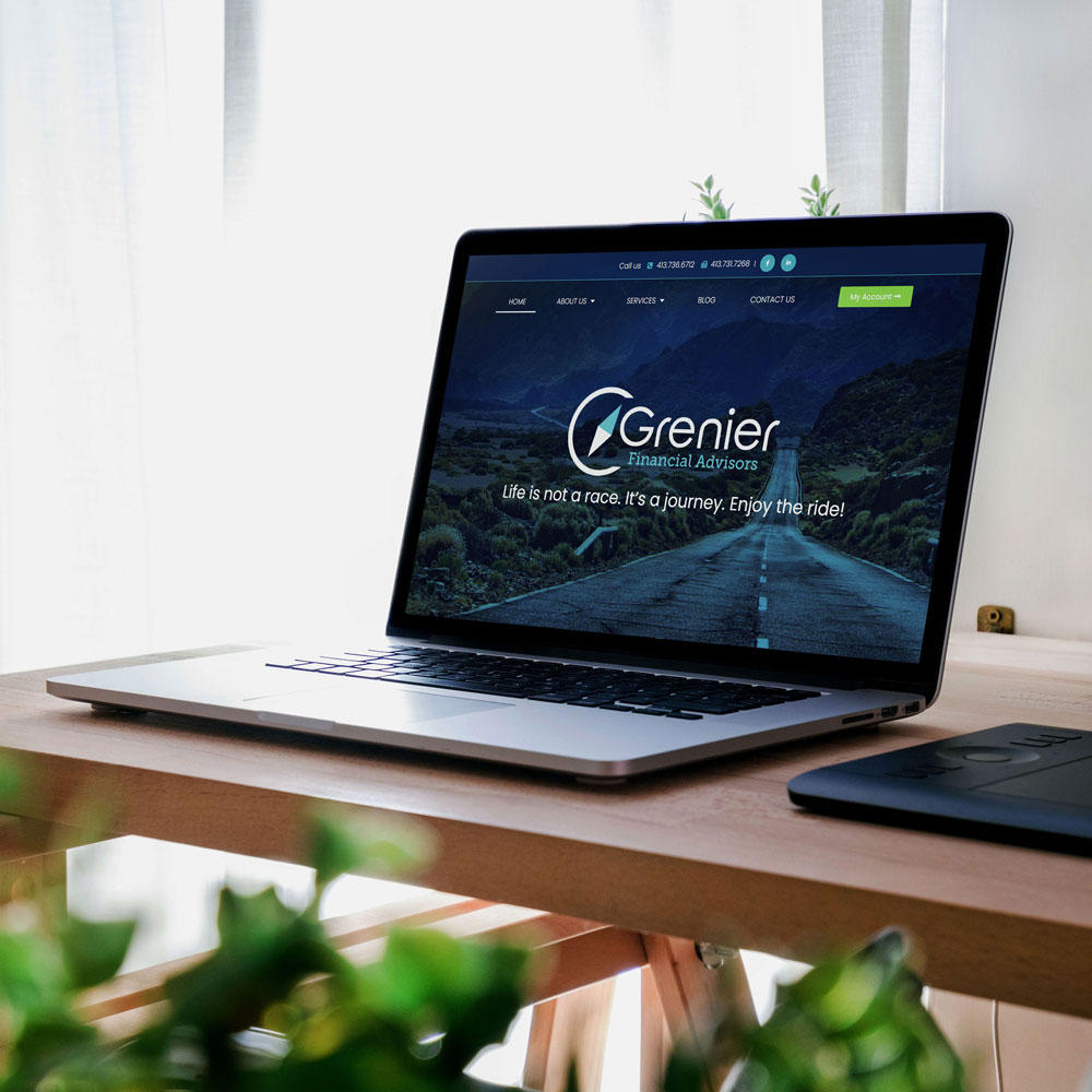 Laptop mockup of website design for Grenier Financial Advisors