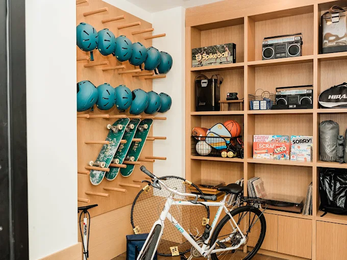 The Gear Garage at The Junto, stocked with bikes, helmets, longboards and games for guests to borrow 