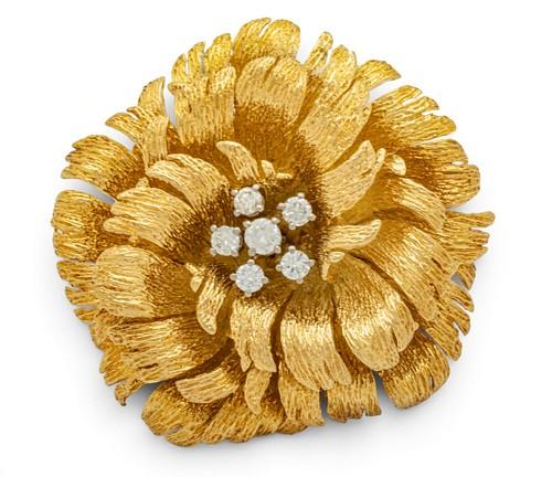 golden flower with 6 diamonds in the center