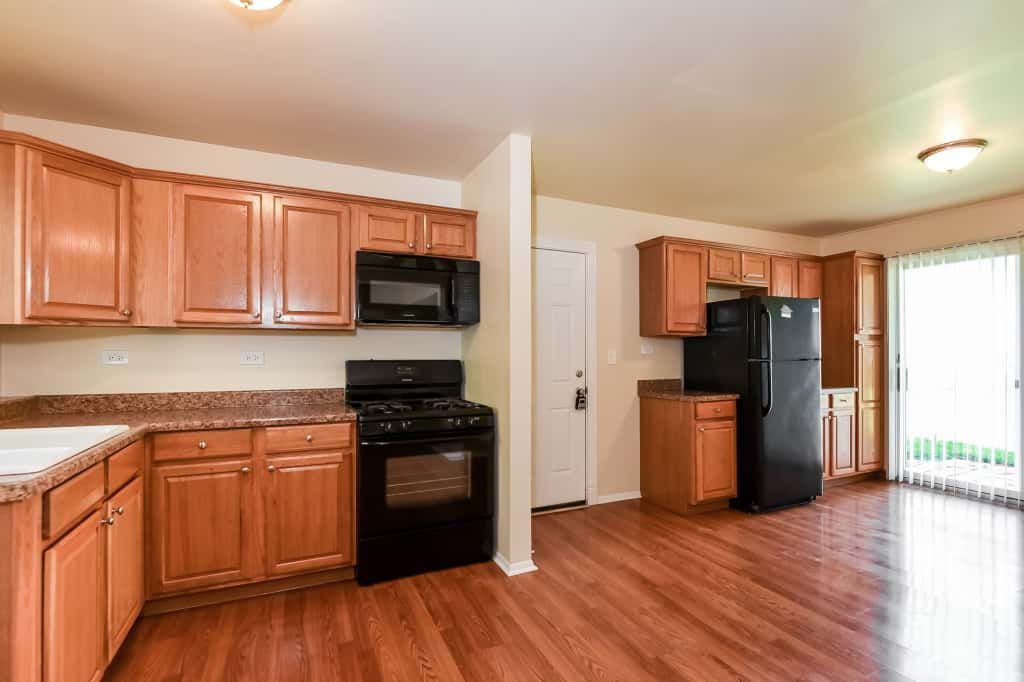 Spacious kitchen with easy outdoor access at Invitation Homes Chicago.