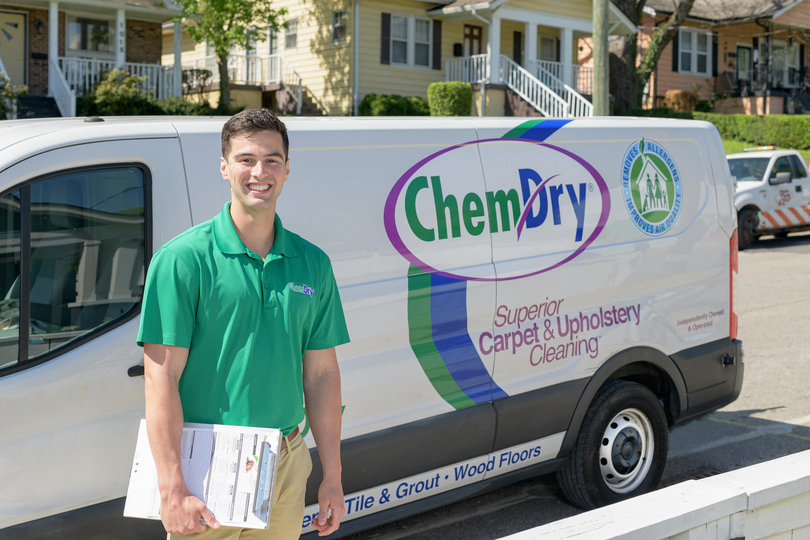 Chem-Dry tech standing next to a van holding a clipboard Chem-Dry of Seattle Seattle (206)783-1003