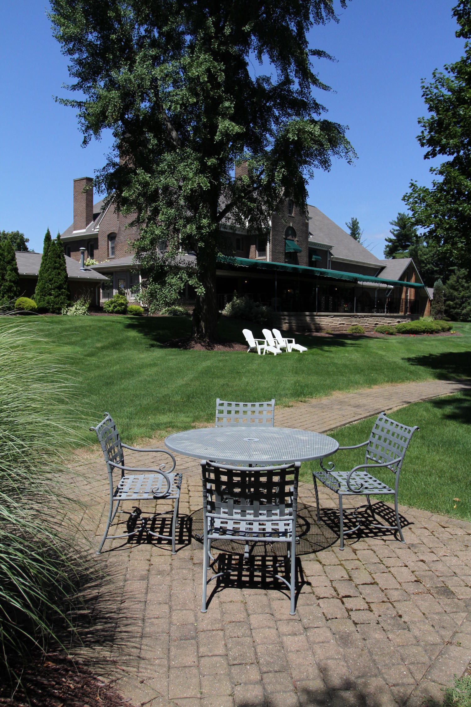 Franciscan Manor patio with table and chairs