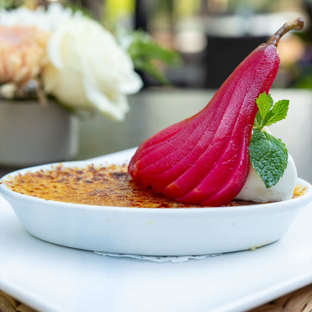 Vanilla Cr&egrave;me Brulee | vanilla Madagascar custard, poached scarlet pear, caramelized sugar, whipped cream, & fresh mint spring