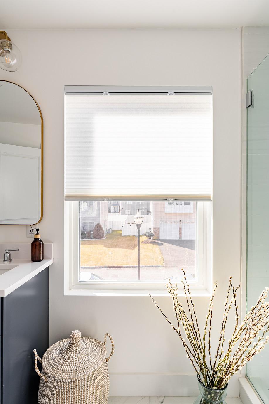 Embrace the luxurious functionality of our Signature Cellular Shades, providing insulation and energy efficiency for a comfortable bathroom environment. These stylish window coverings bring a touch of elegance and privacy to your sanctuary, transforming it into a tranquil retreat.