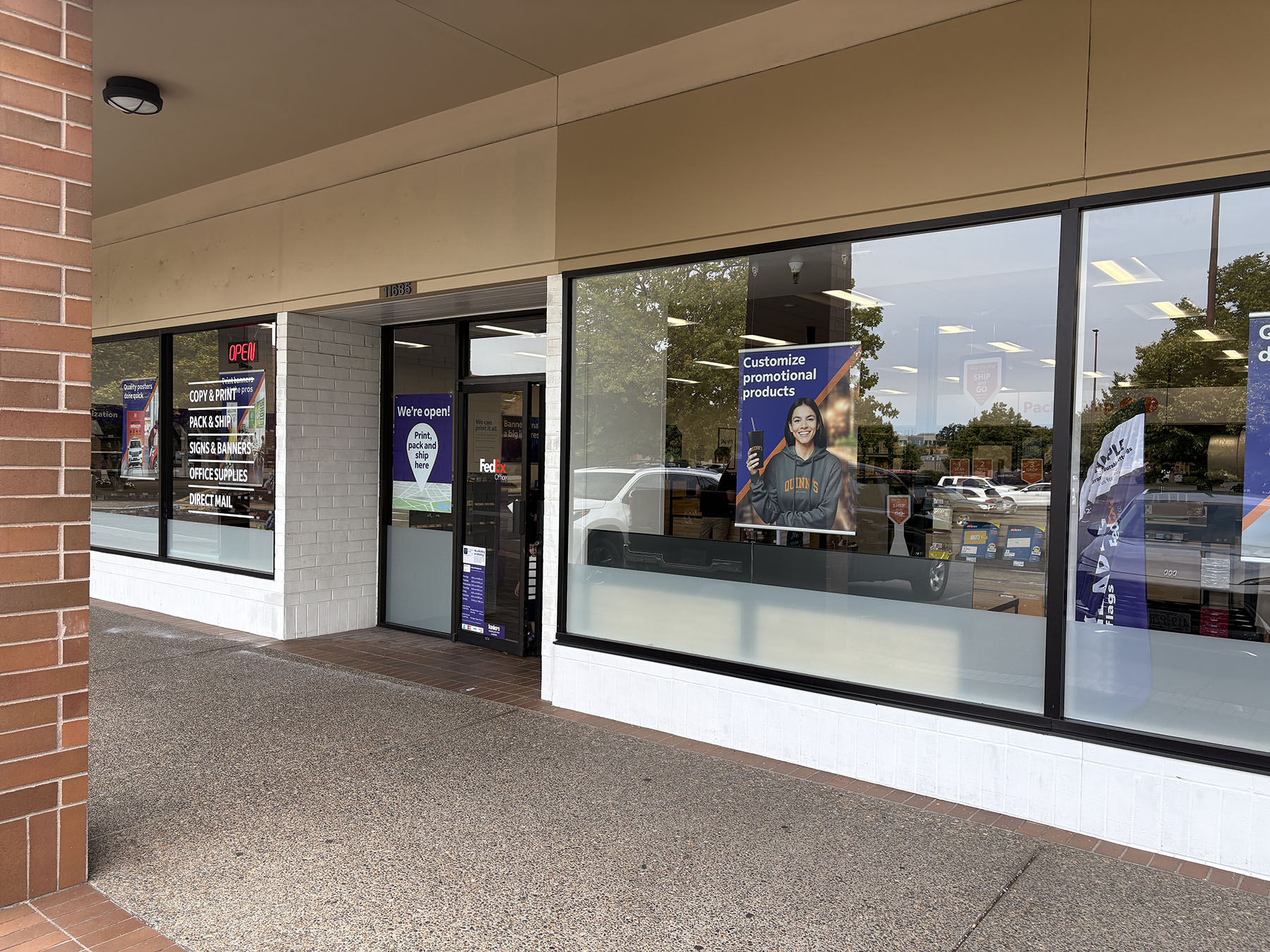 Entrance and Exterior Walkway &ndash; Entrance to FedEx Office in Beaverton Town Square with clear signage for print, pack and ship services.