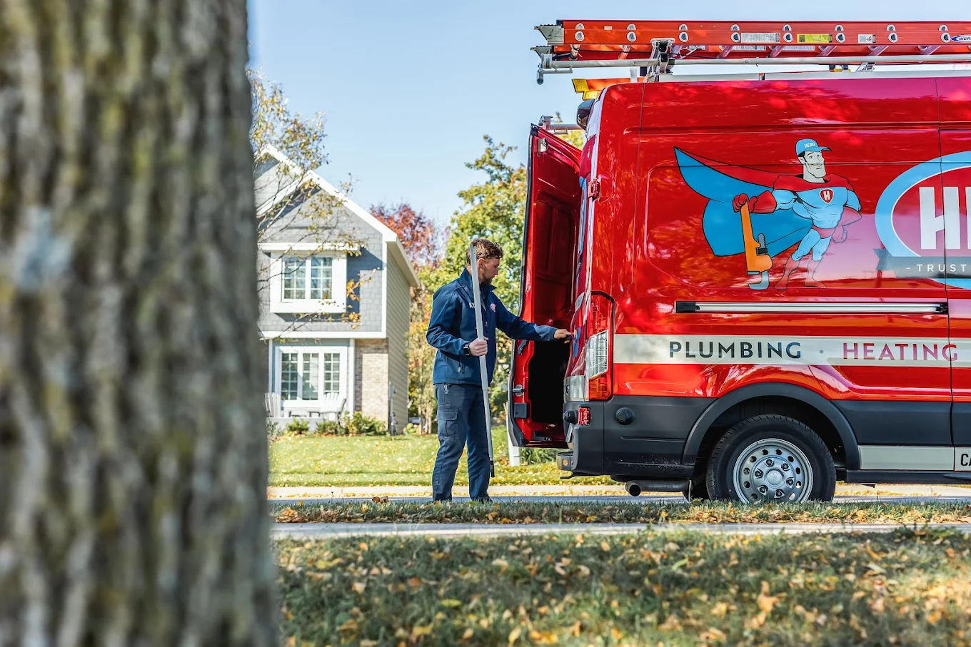 Hero: Plumbing, Heating, Cooling, Drains, Ducts & Electrical worker near van