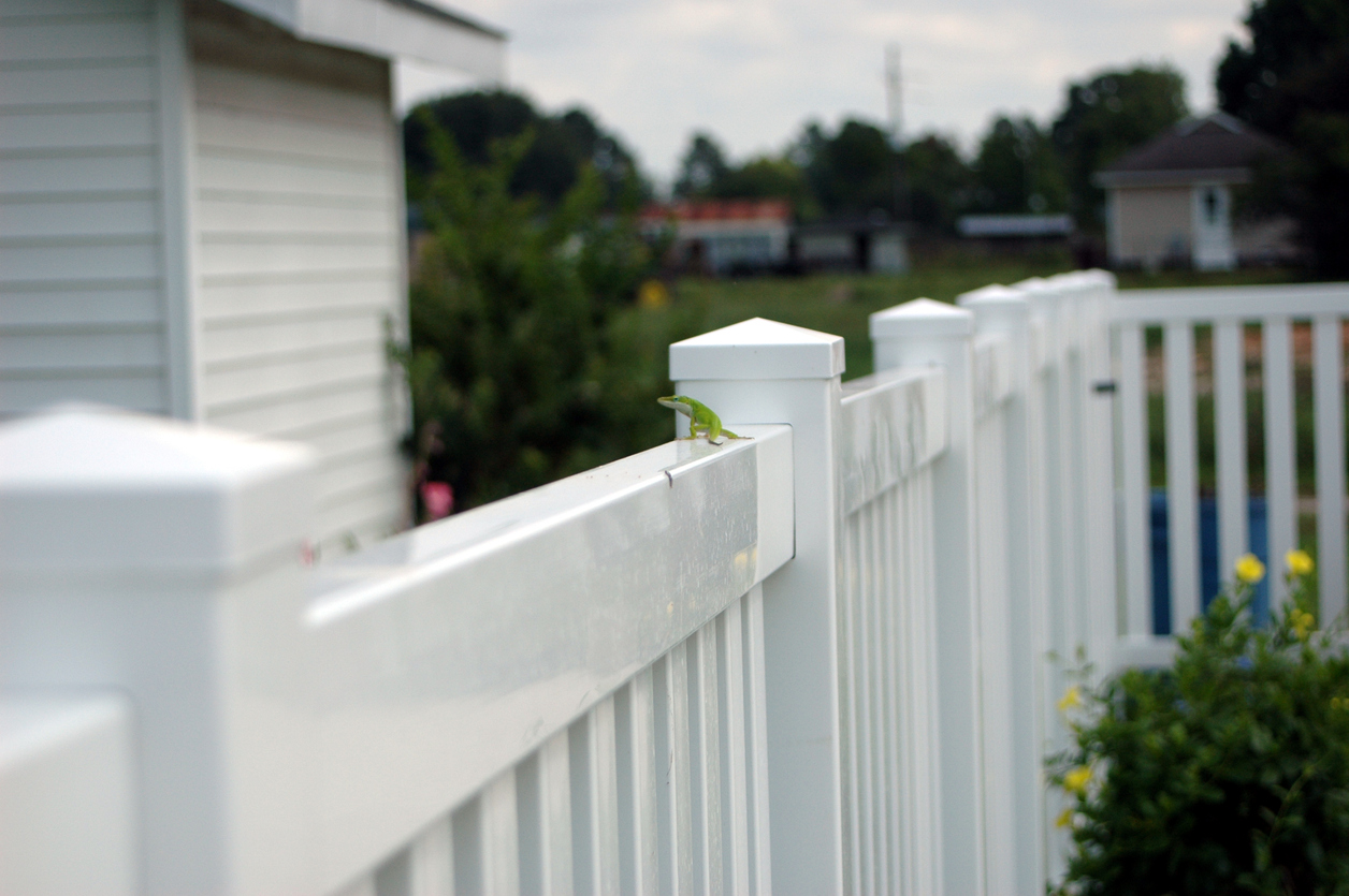 white vinyl fence and fence post tops