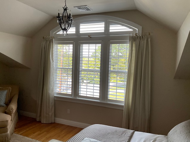 Do you have an architectural window you want to cover? We've got you! Our beautiful Shutters are designed to fit any windows - as you can see in this bedroom in Ossining - turning them into a stunning focal point!