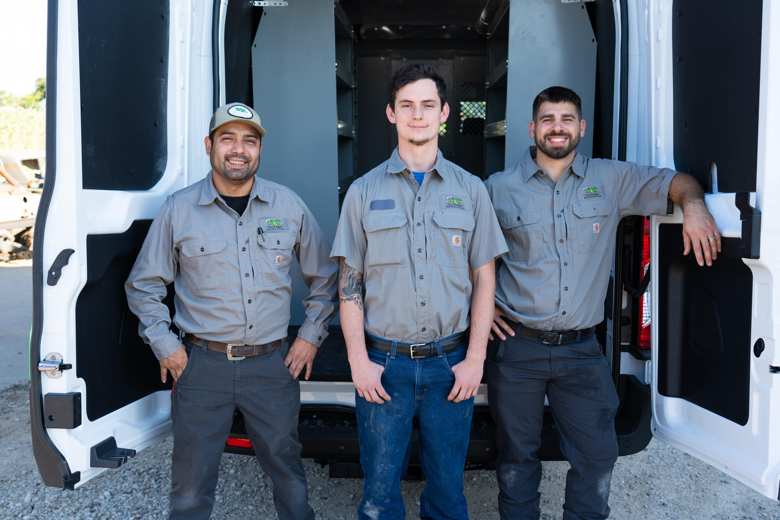 Some of the amazing Plumbing Service and Electrical Services team from Tioga Contractors with the utility van in the Hurst, TX area.