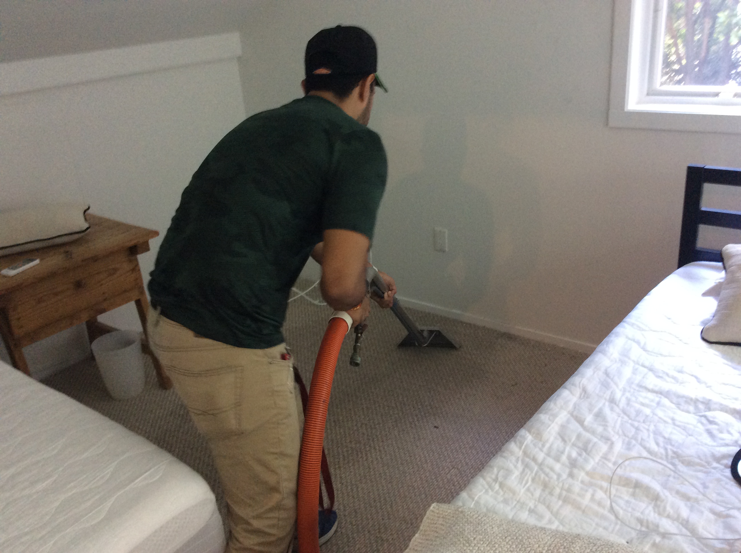 A SERVPRO technician extracting the water from the carpet in this home at Century Village.