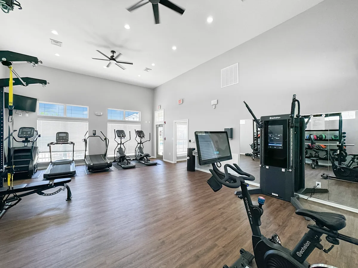 the residence apartments fitness room with weights and cardio equipment at 92West, West Des Moines, IA