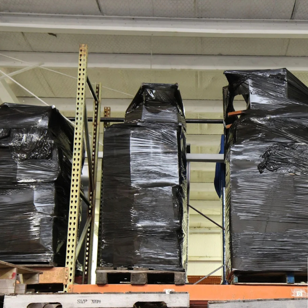 Commercial items shrink-wrapped and palletized inside a warehouse as part of Econo Move & Storage’s  