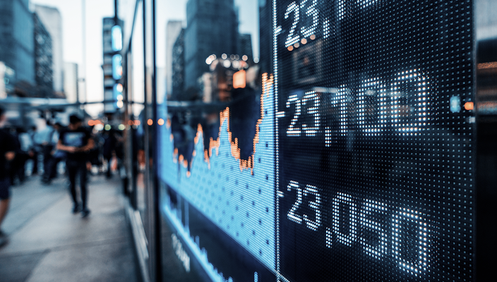 Daily stock positions on a public screen at street level.