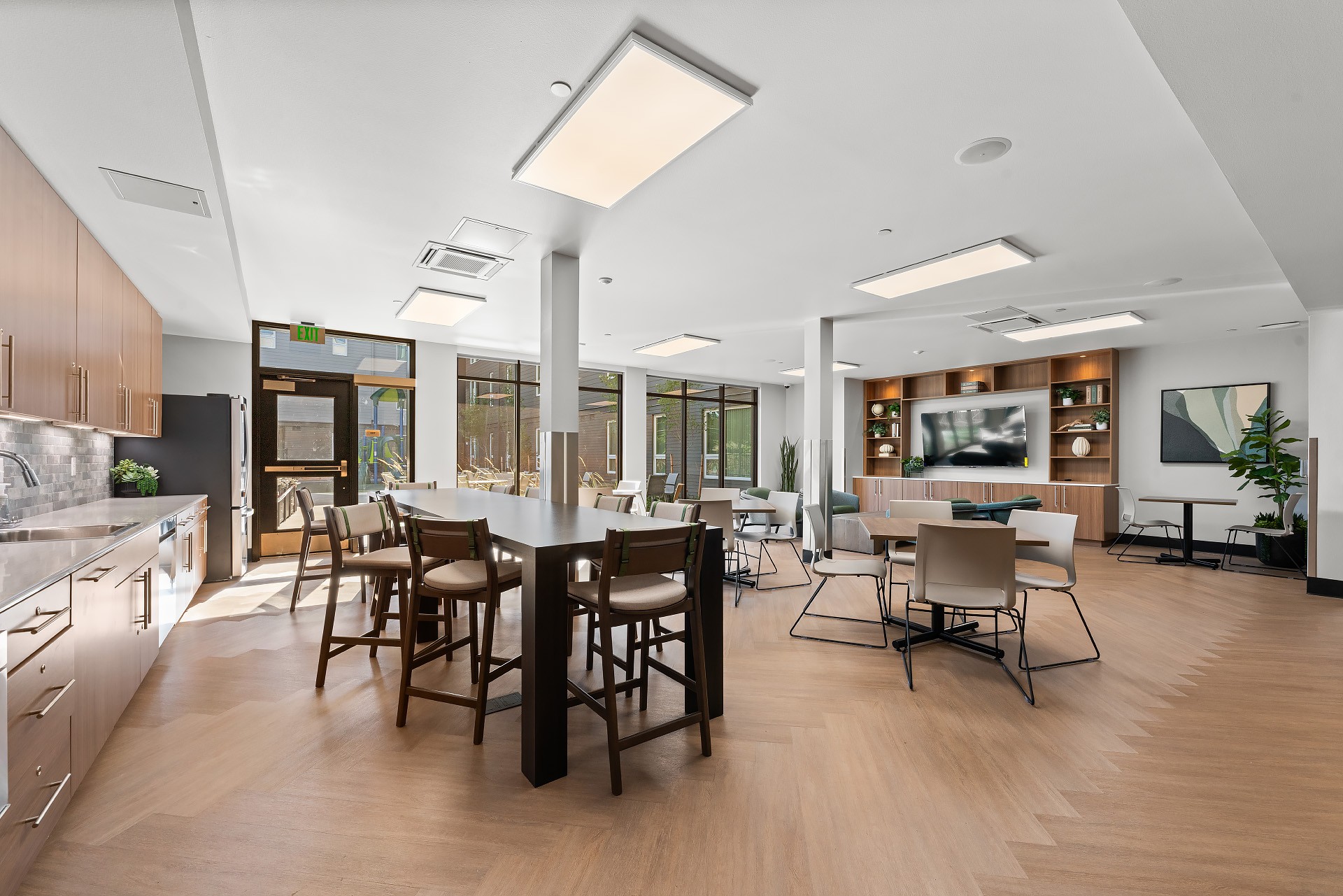 A modern kitchen with a dining table and chairs.at Terracina Vista, Oregon, 97233-4299