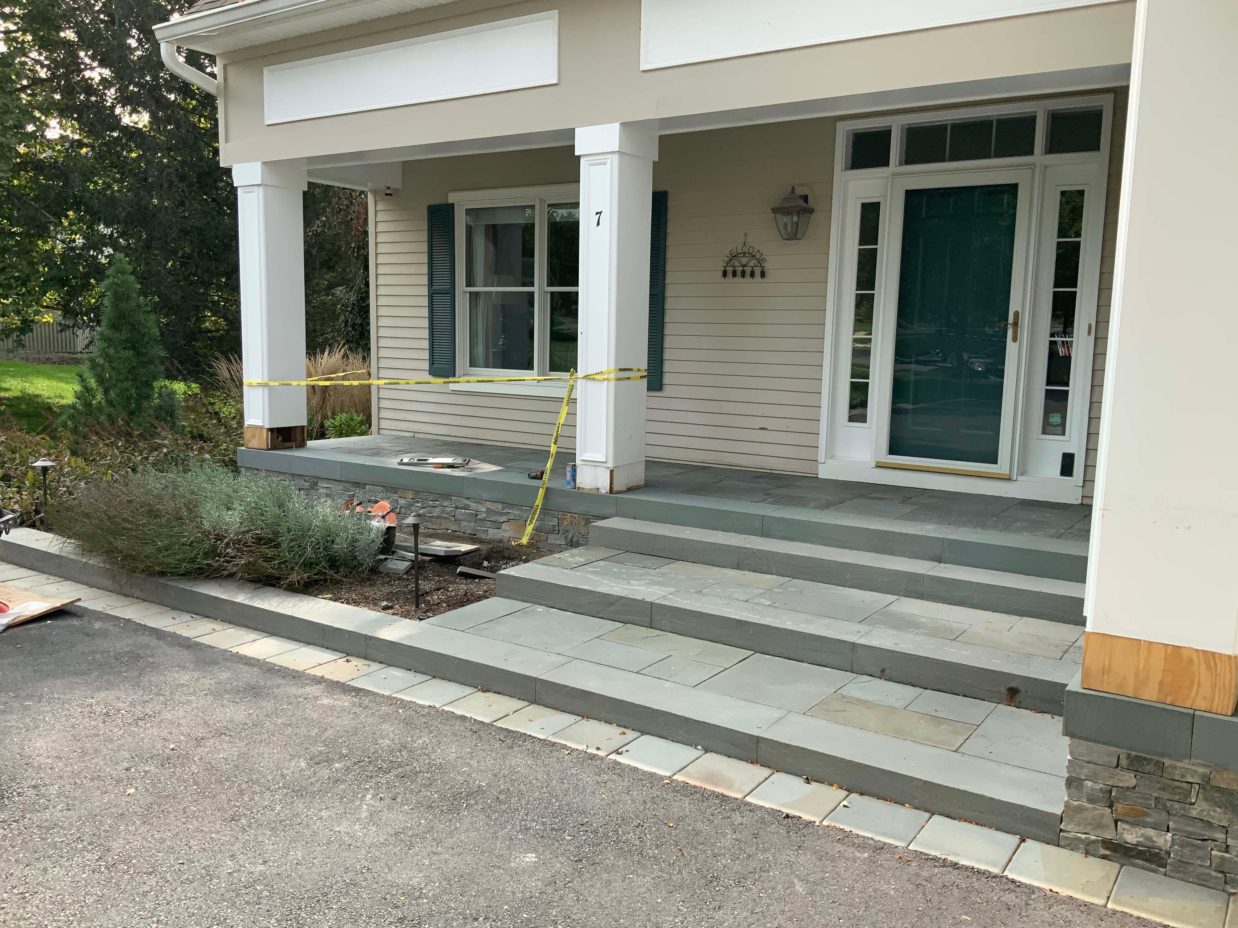 We completed this front porch last year which was the final phase of a multi-year master plan design build project.  Our clients appreciation for the outdoors and what we have created for him and his family is expressed in his smile!  On a couple occasions we have had the opportunity to enjoy the bar and fire feature with our client!  www.gardenartisansllc.com