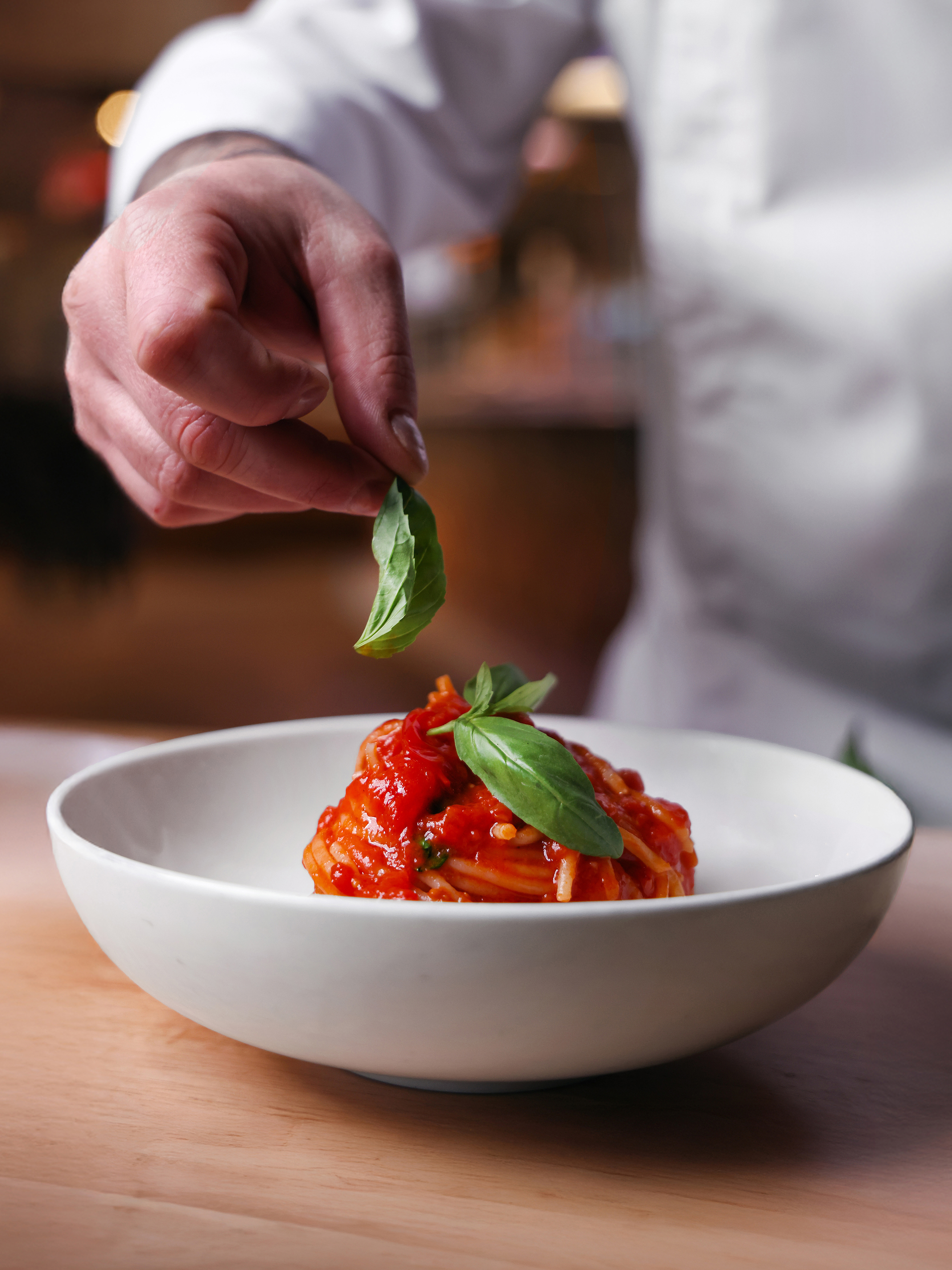 Classic spaghetti al pomodoro finished with fresh basil. 