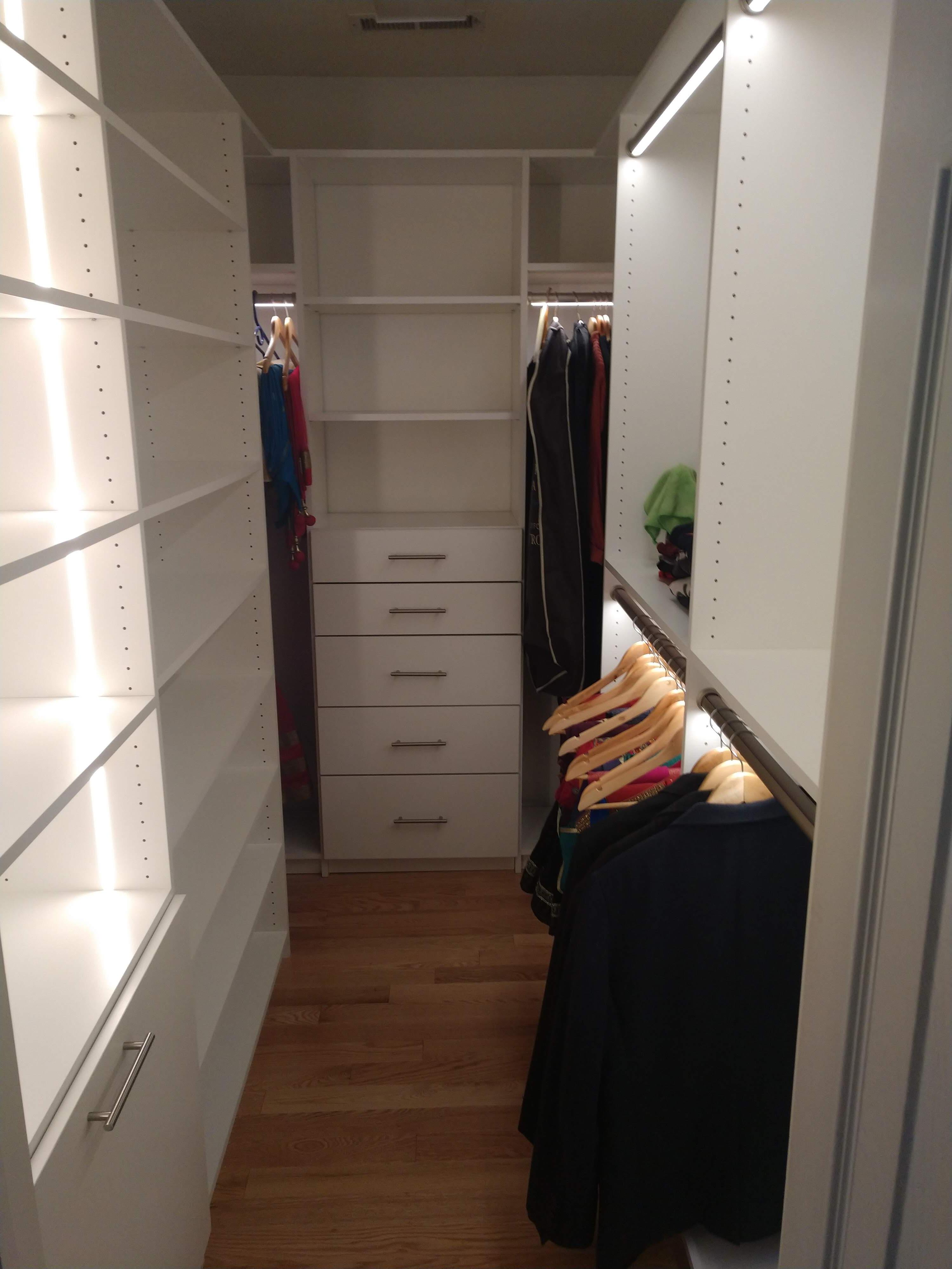 Custom walk in closet with LED closet rods and recessed LED strip lighting in State College