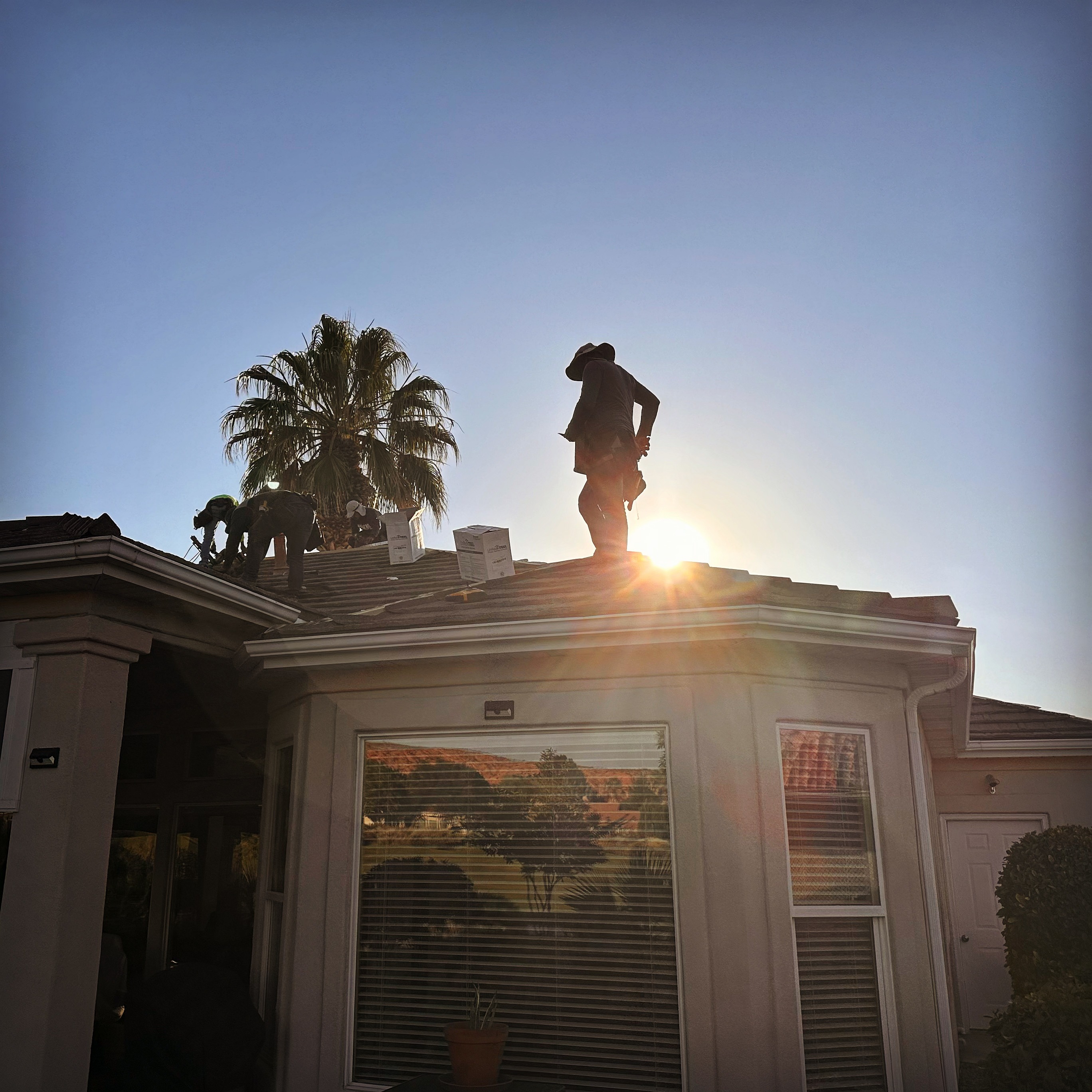 Arizona roofers from R1 Roofing & Exteriors installing tiles on a residential home