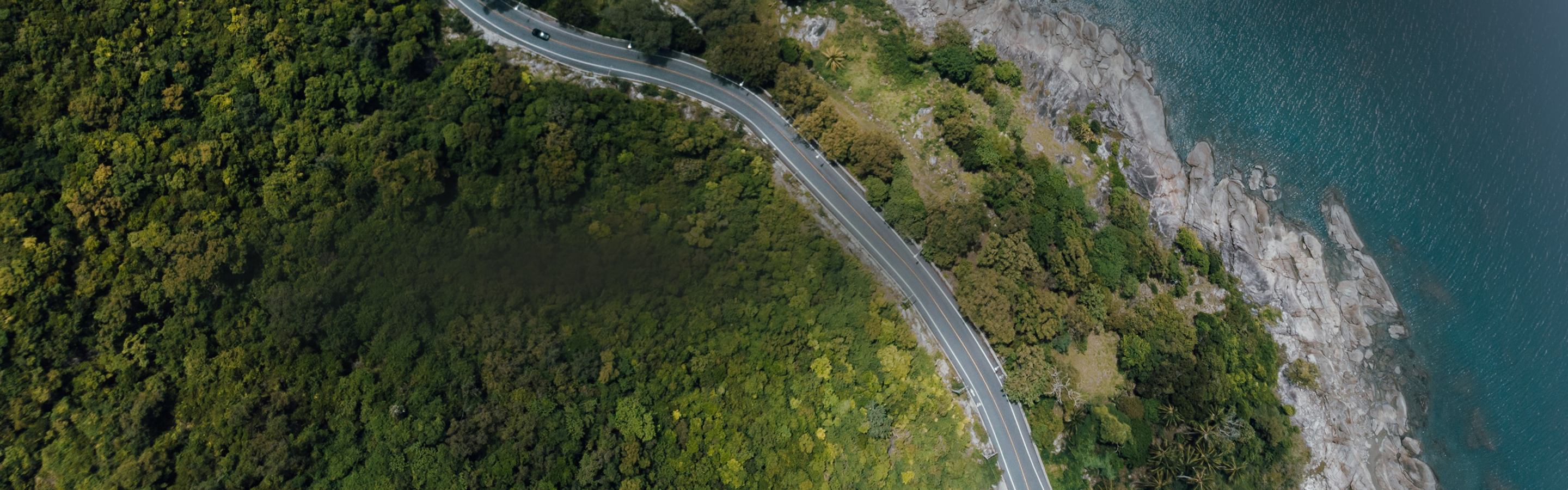 Aerial view of a coastal highway.