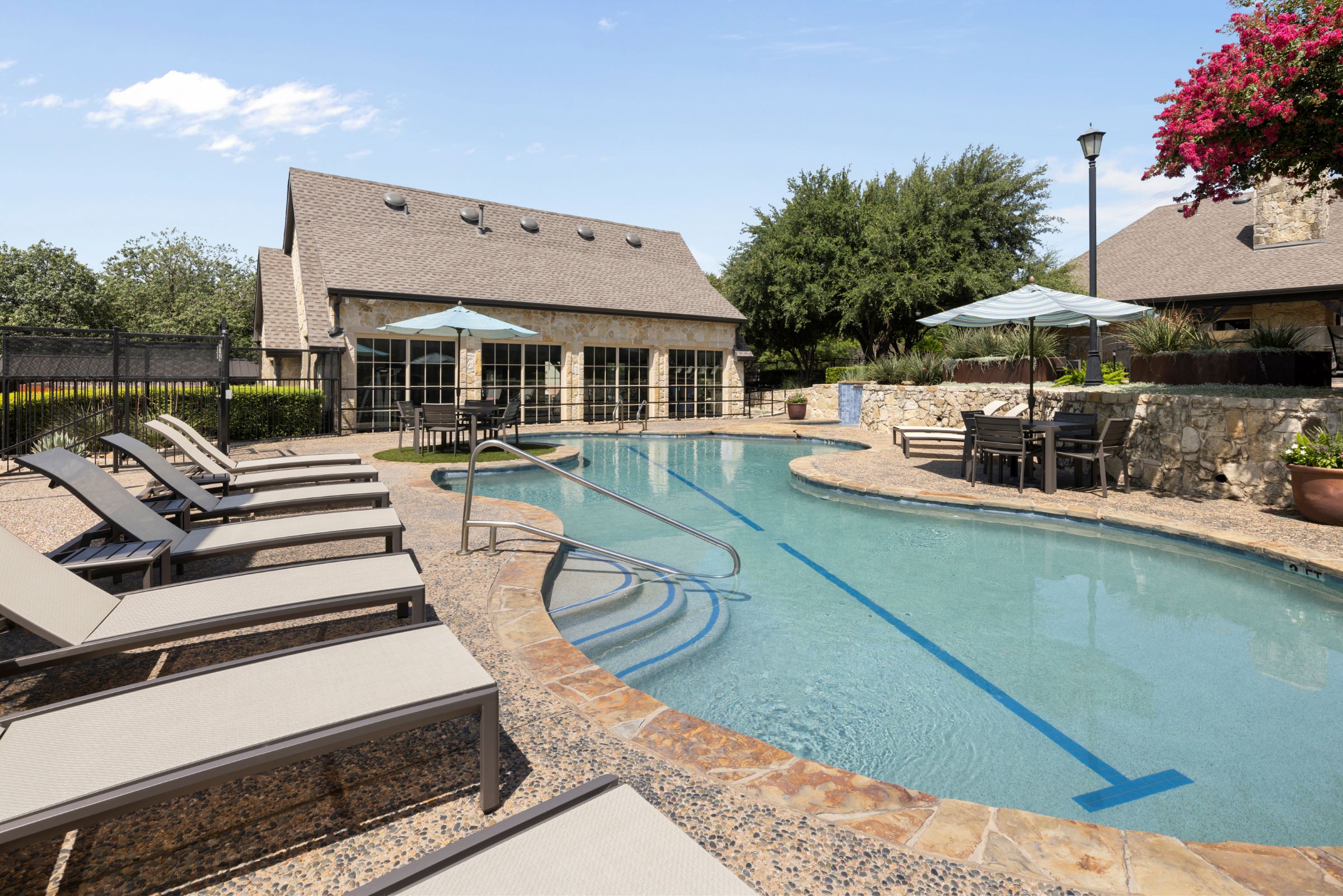 Lower level of resort-style pool with swim lane at Camden Shadow Brook apartments in Austin, TX 