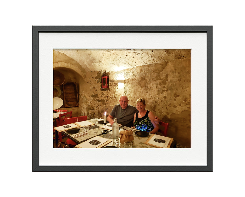 Gord and Helen in Italy at a nice dinner.