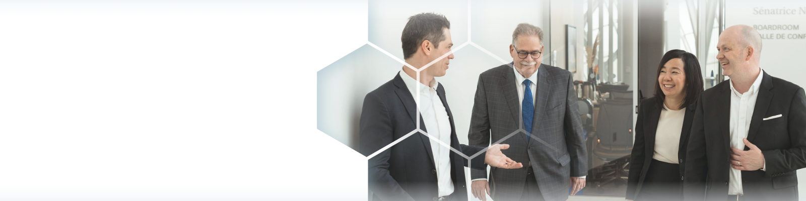 The Winestock Childerhouse team walking down an office hallway.