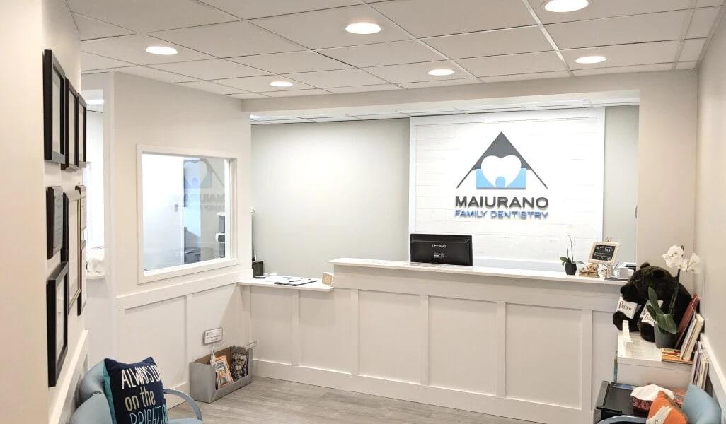 Reception desk and waiting area at Maiurano Family Dentistry in Springfield.