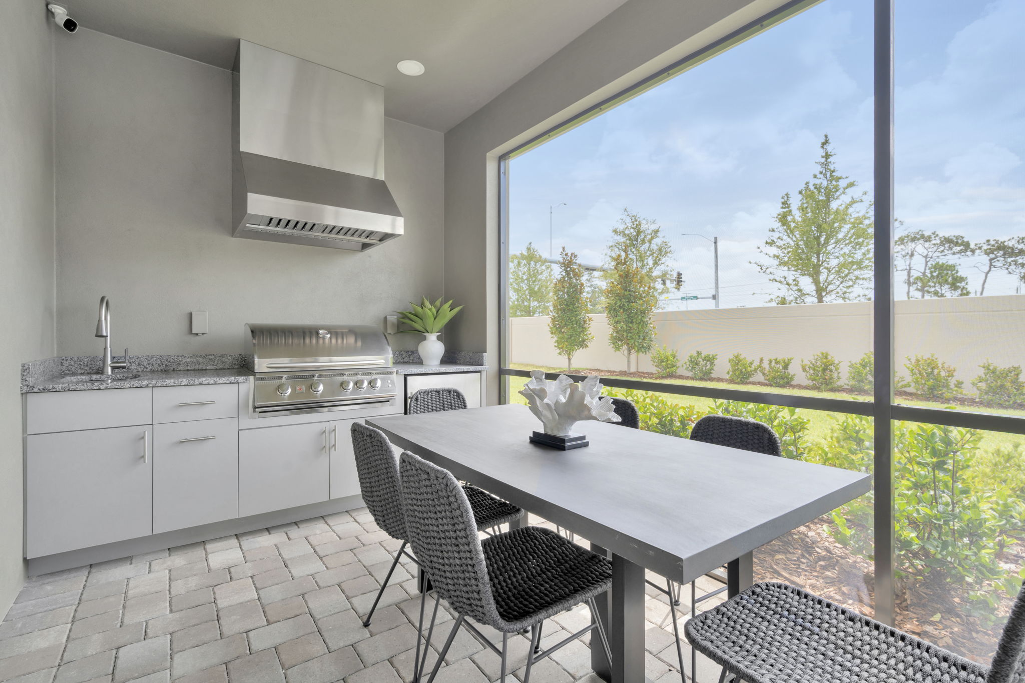 The Covered Lanai of DRB Homes Cocoplum Home Plan at Primrose at Longleaf in New Port Richey, FL.