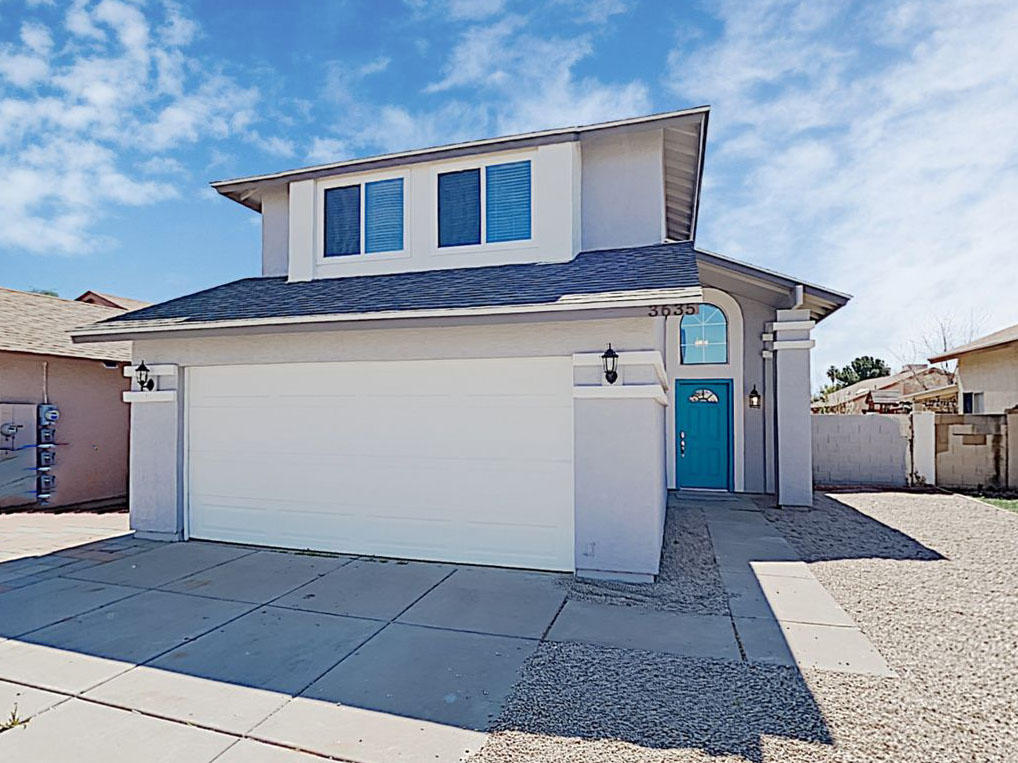 Beautiful two-story home with a two-car garage at Invitation Homes Phoenix.