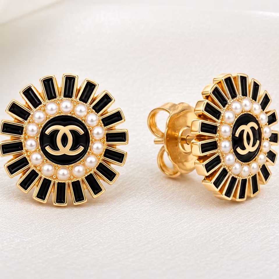The Pink Pearl Soleil Earrings feature soft pink enamel, gold-tone details, and a halo of luminous pearls in a timeless sunburst design for everyday wear and special occasions.