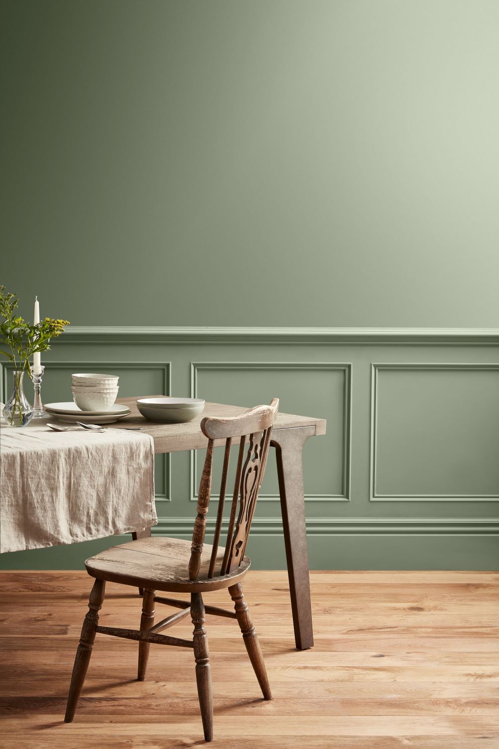 A sage green dining room wall.