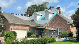 Workers are fixing rooftop of a house