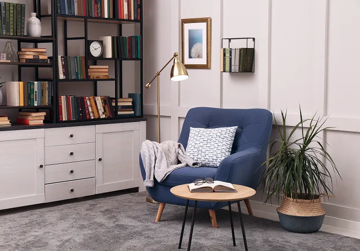 A beautiful and inviting office setting with a bookshelf.