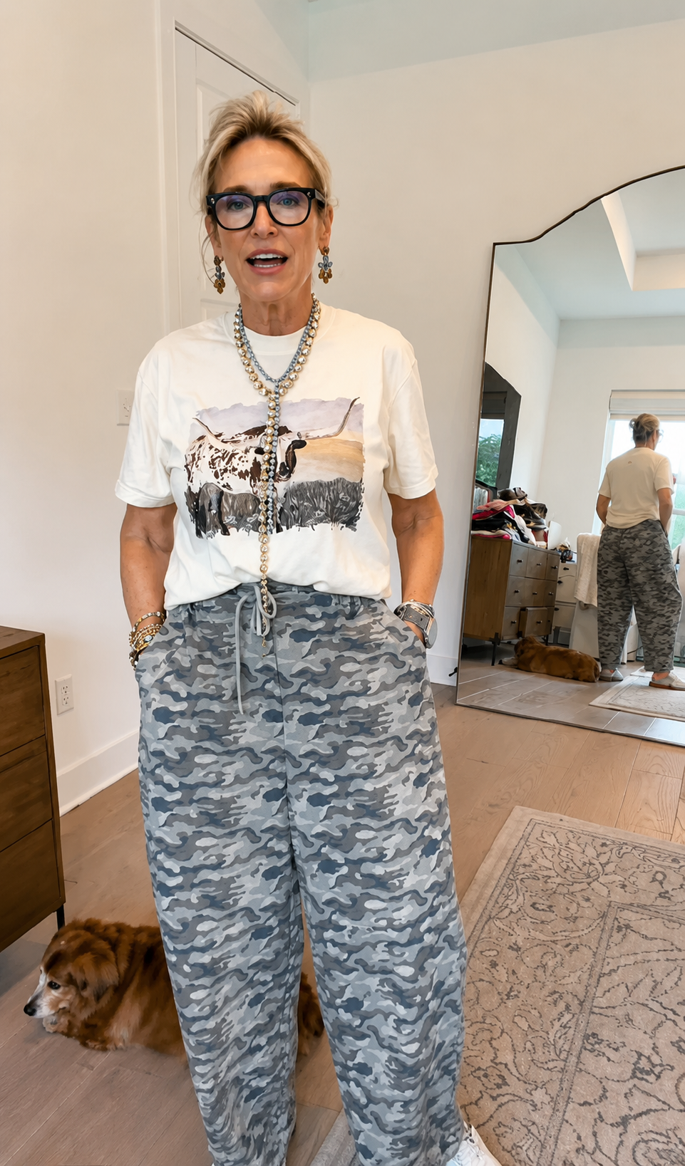 Today&rsquo;s OOTD is a fun one. ???? I&rsquo;m wearing the cutest wide leg camo pants - they&rsquo;re lightweight and honestly the perfect summer camo.
I paired them with this adorable Bart The Longhorn Graphic tee. Fit note: I&rsquo;m in my true size, and if you know Comfort Colors tees, you know the neck opening can feel a little snug when you&rsquo;re pulling it on&hellip; so be careful you don&rsquo;t rub all your makeup off. ????
But what makes this Monday outfit extra fun is the TOVA. 
I&rsquo;ve got the L.A. necklace on in the regular and the mini, the Frida earrings, and some TOVA bracelets. It&rsquo;s all sparkly, all happy, and a reminder you don&rsquo;t have to wait for the &ldquo;perfect&rdquo; outfit. Just put the jewelry on and suddenly you&rsquo;re excited to get dressed.
I&rsquo;m headed to the boutique - my husband&rsquo;s coming with me so we can decorate the outside for Fourth of July. ???????? We&rsquo;re open 10&ndash;4 today, come see us!
And don&rsquo;t forget ✍️&hellip; tomorrow night at 7pm is our first official LIVE with Rhonda! Be sure to go back and register so you can shop fast while we&rsquo;re live.