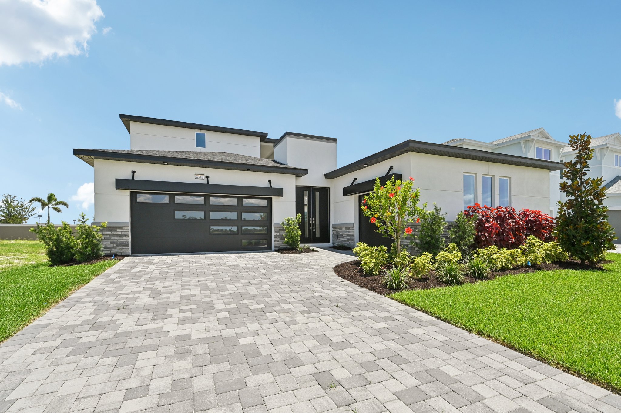 The Front Elevation of a DRB Homes Quick Move-In Home at Biscayne Landing at Seaire in Parrish, FL.