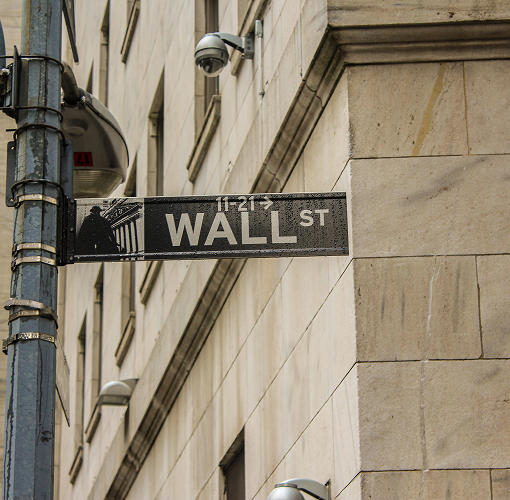 A close-up of a Wall Street sign in New York City.
