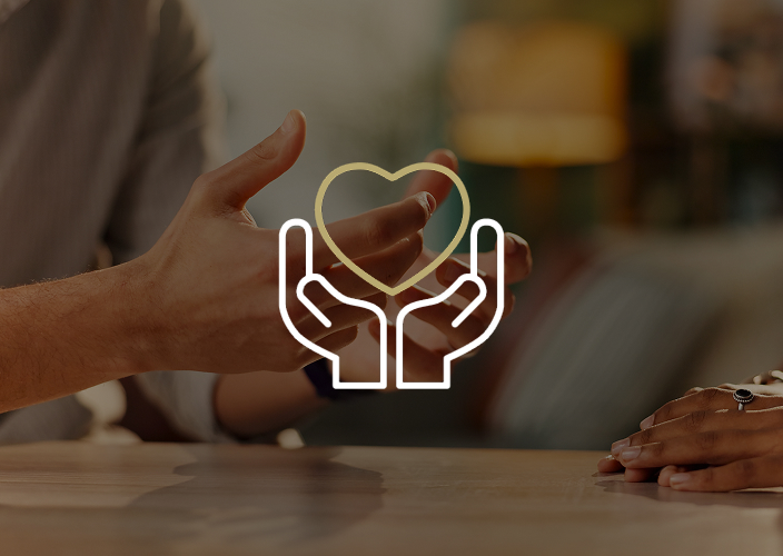 Hands gesturing across a table during a conversation.