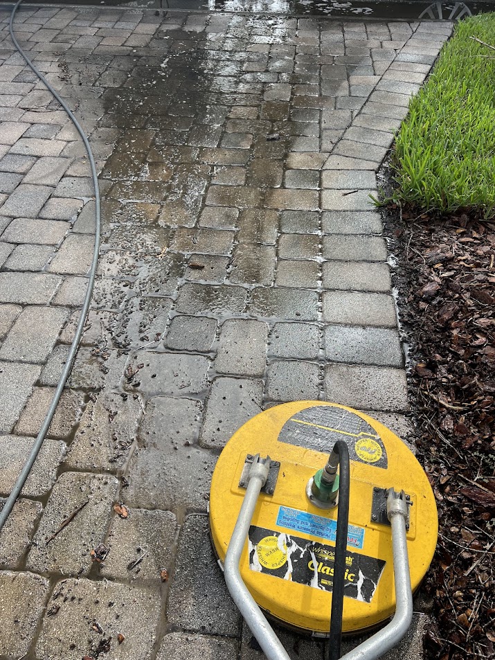 Professional paver driveway and walkway pressure washing by R & R Elite Pressure Washing in Davenport, FL, removing dirt, algae, grime, and organic buildup.