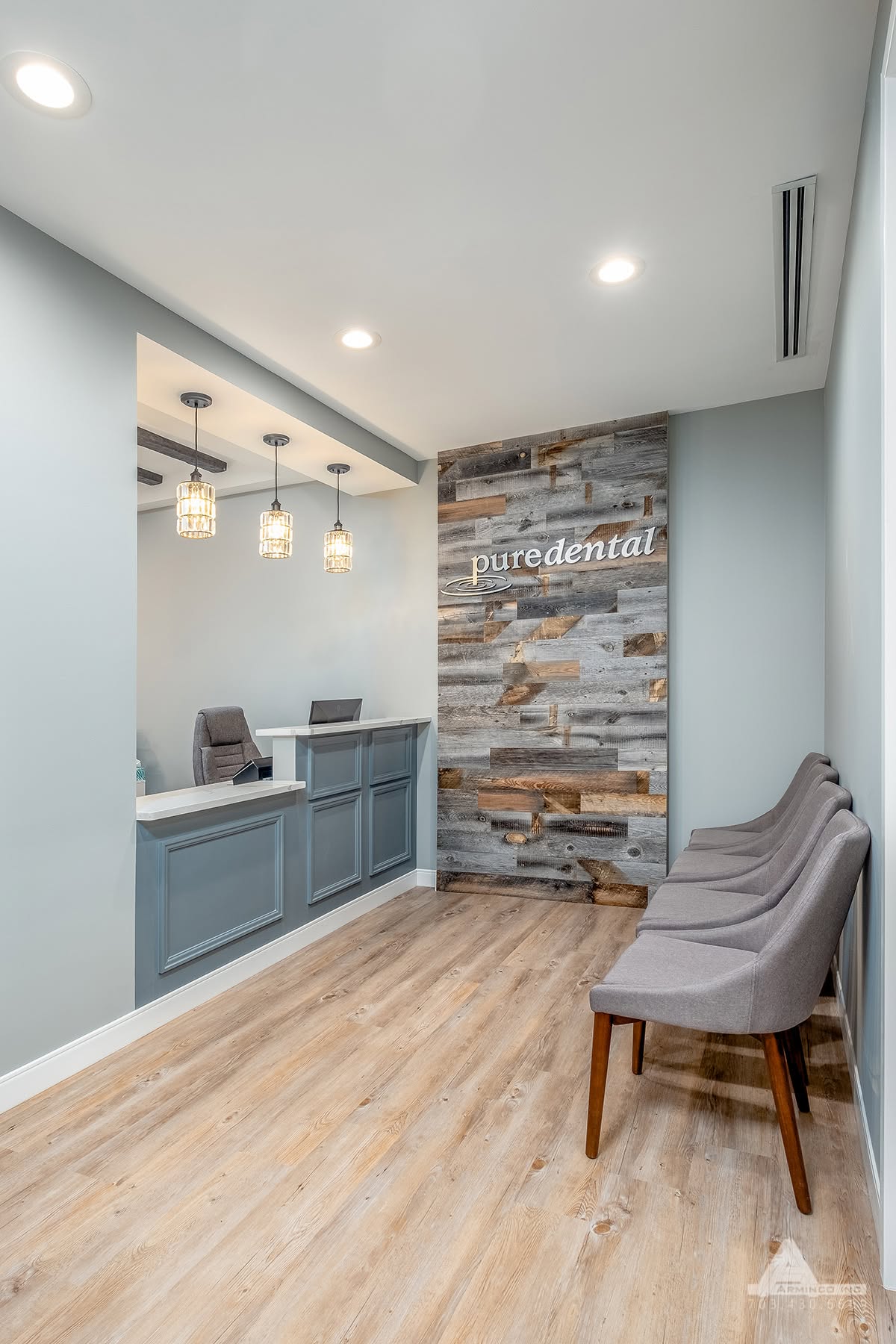 Reception area at Pure Dental featuring a welcoming front desk, contemporary décor, and patient chec 