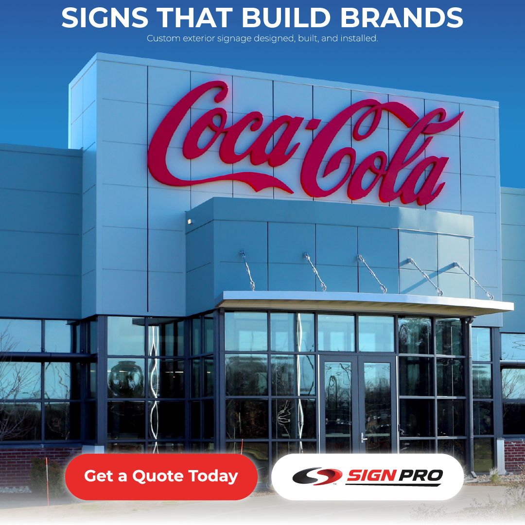 A large custom Coca-Cola building sign designed and installed by Sign Pro, Inc., highlighting the company’s ability to create brand-defining exterior signage for corporate and retail clients.