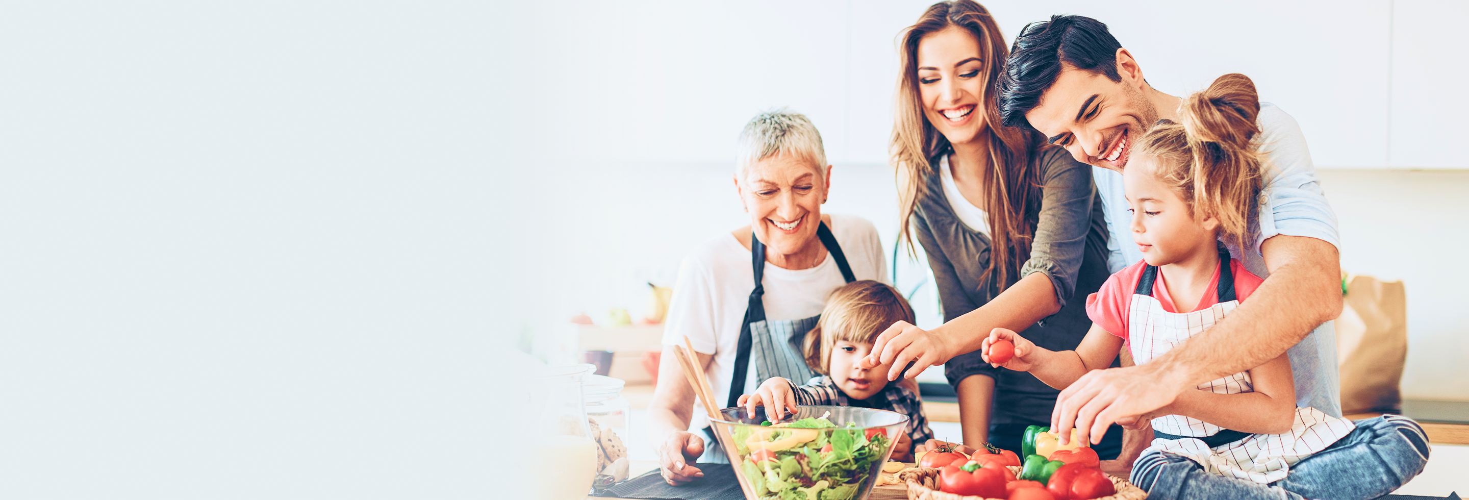 Multigenerational family cooking together.