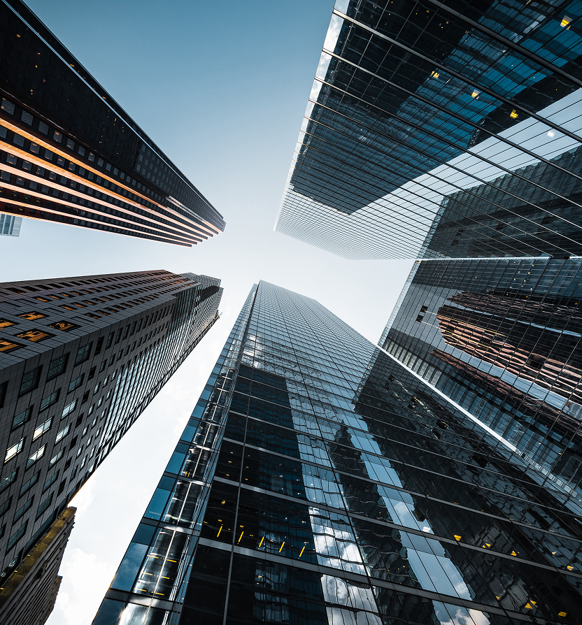 A bottom-up view of skyscrapers.